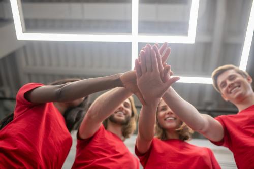 volunteers-young-people-red-tshirts-looking-joyful-happy